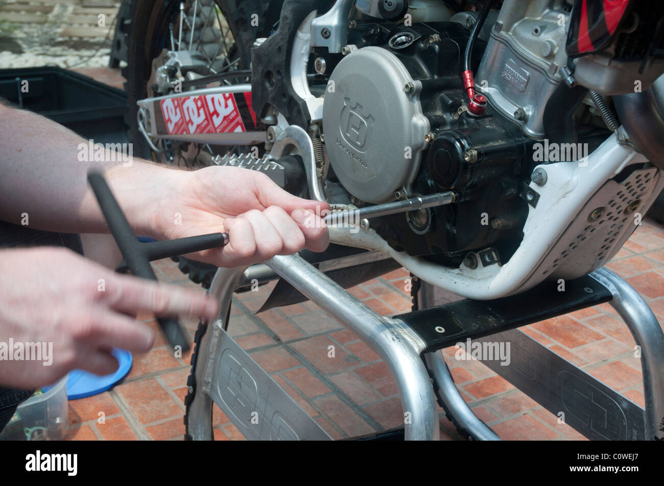 Replacing oil filter in Husqvarna motor cross bike Stock Photo Alamy