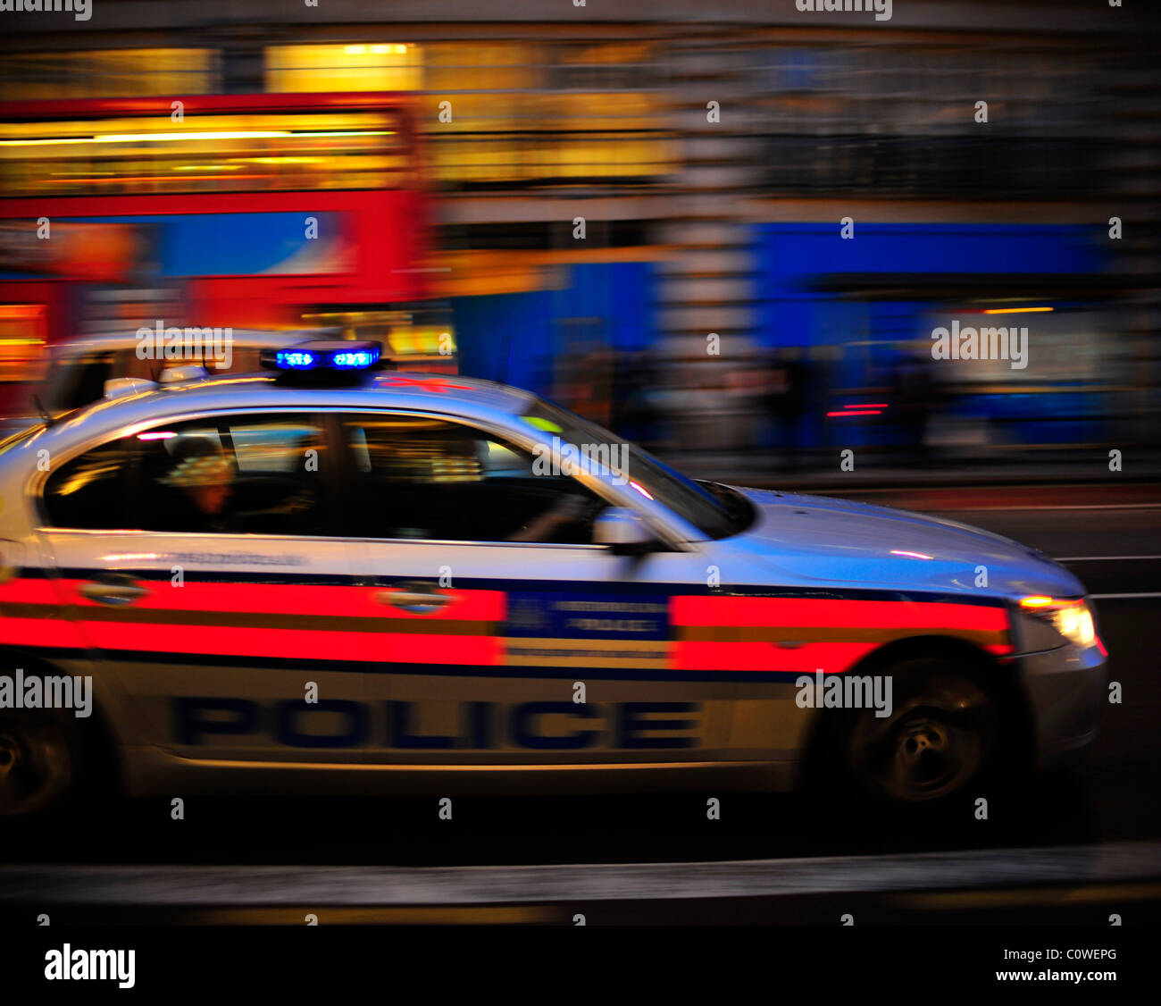 Metropolitan Police Firearms Vehicle moving fast with blue lights flashing in London Stock Photo