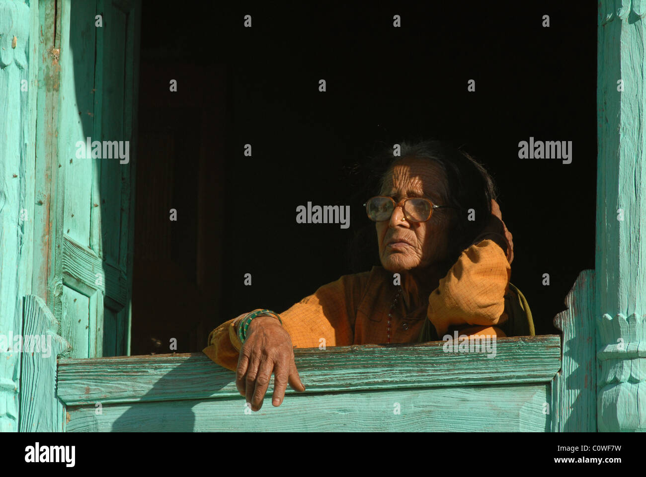 Portrait , An Old lady looking lost in her thoughts, her old age is shown more her wrinkles then her Grey hair, India. Stock Photo