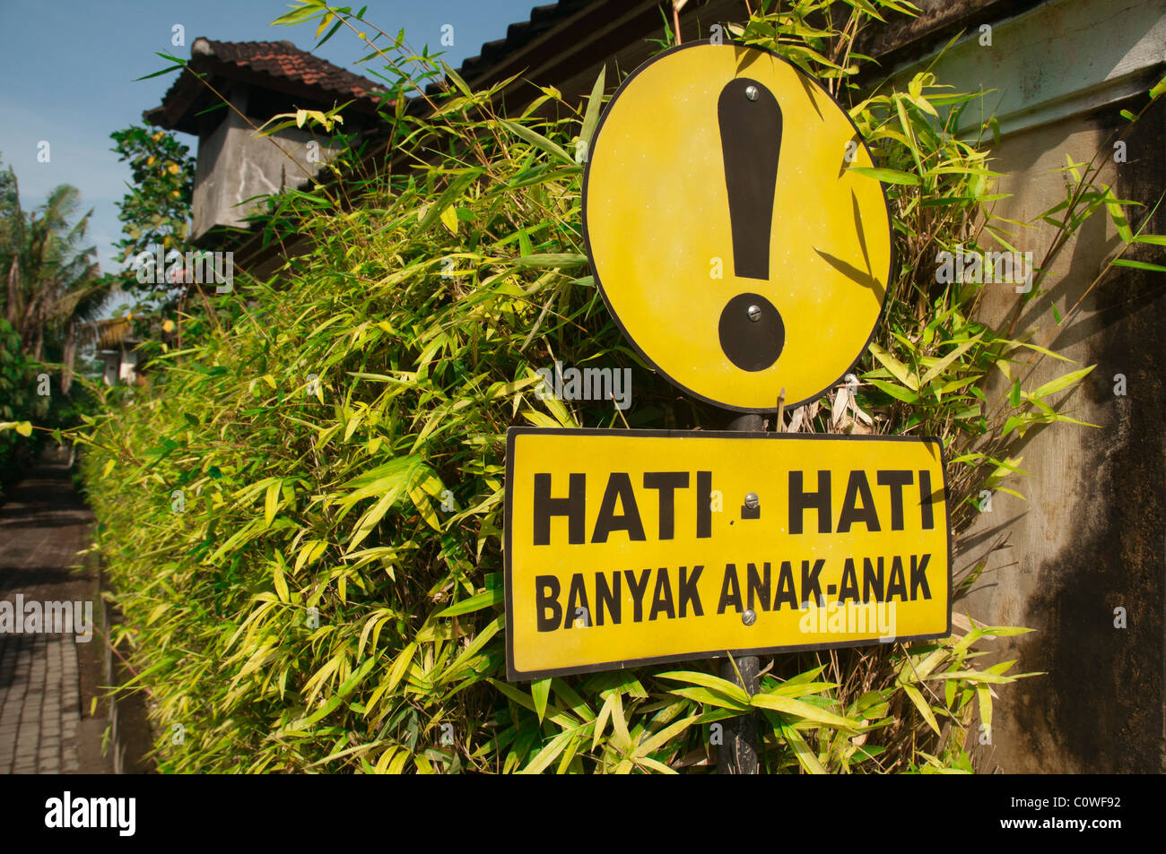 Indonesian road sign warning of children ahead. Literal translation: Be Careful, many children Stock Photo