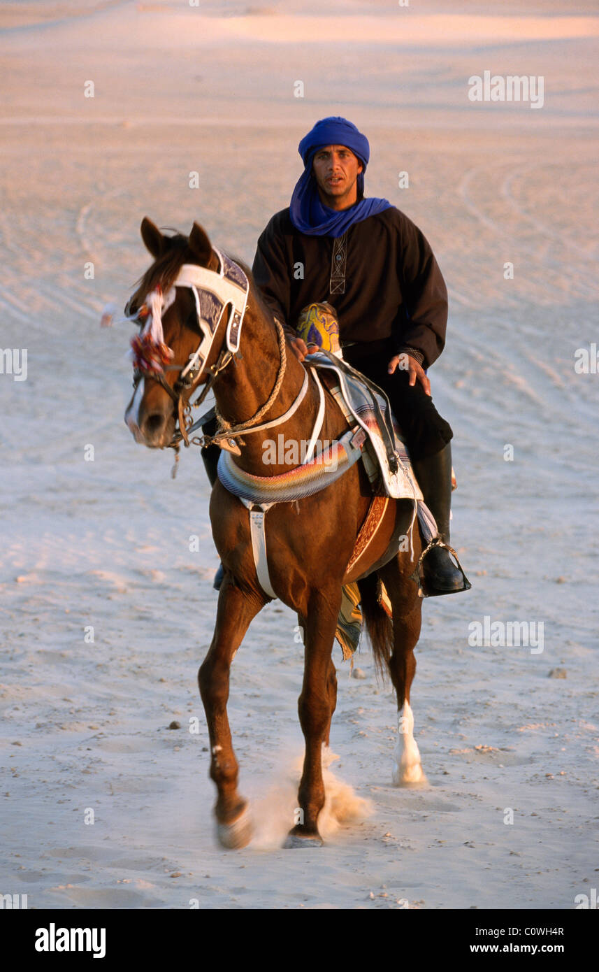 Rider near  Douz, Tunisia Stock Photo