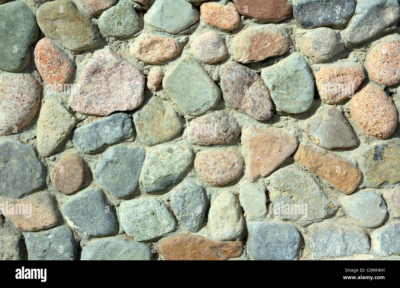 photo of wall of rock stones - background Stock Photo - Alamy