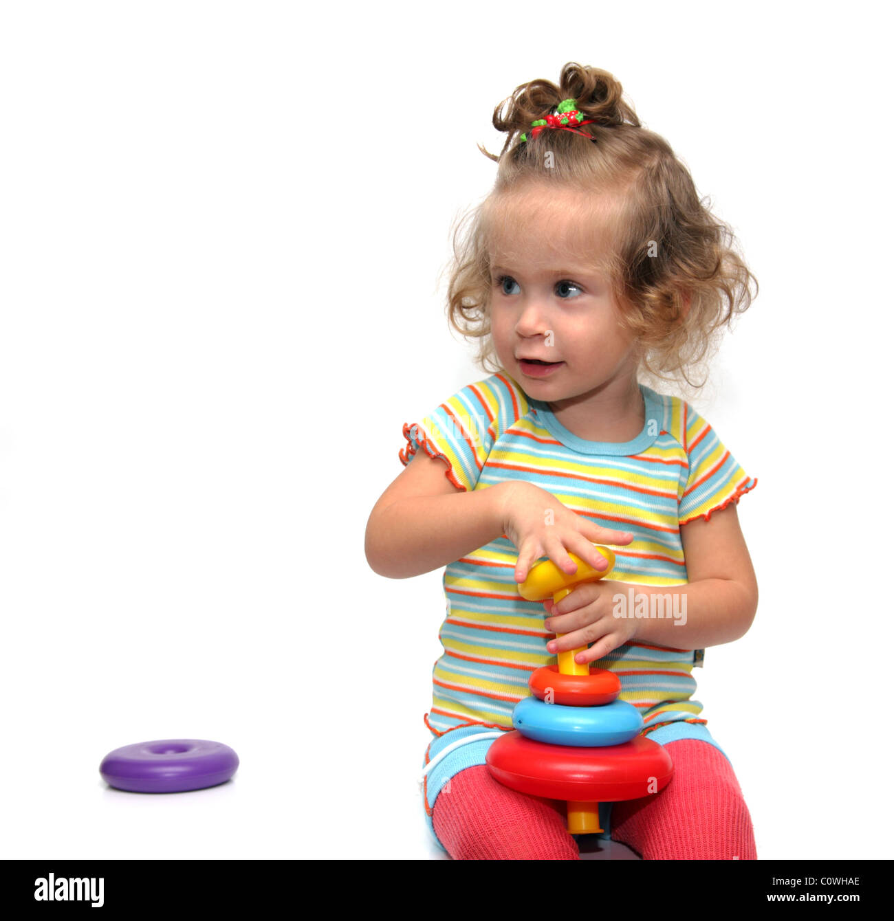 cute little girl playing with pyramid on white Stock Photo - Alamy