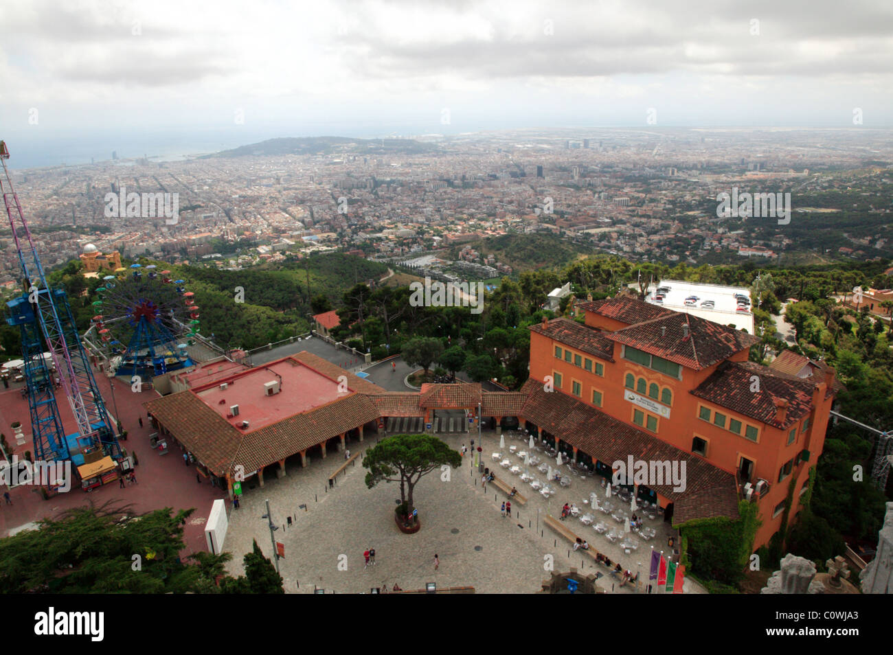 Wide-angle view of Barcelona and the Tibidabo theme park,  taken from the top of Temple de Sagrat Cor. Stock Photo