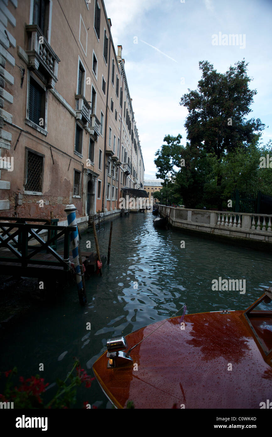The view from a water taxi pulling away from the Hotel Bellagio in the city of Venice, Italy. Water tavis are the only way to navigate the waterways. Stock Photo