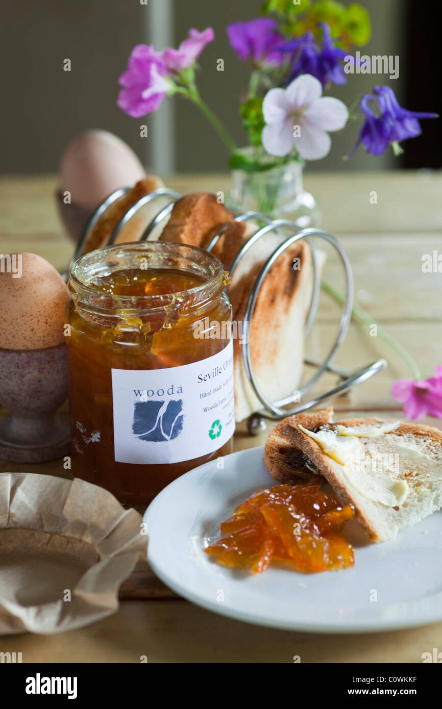 Breakfast setting with marmalade, eggs and toast Stock Photo