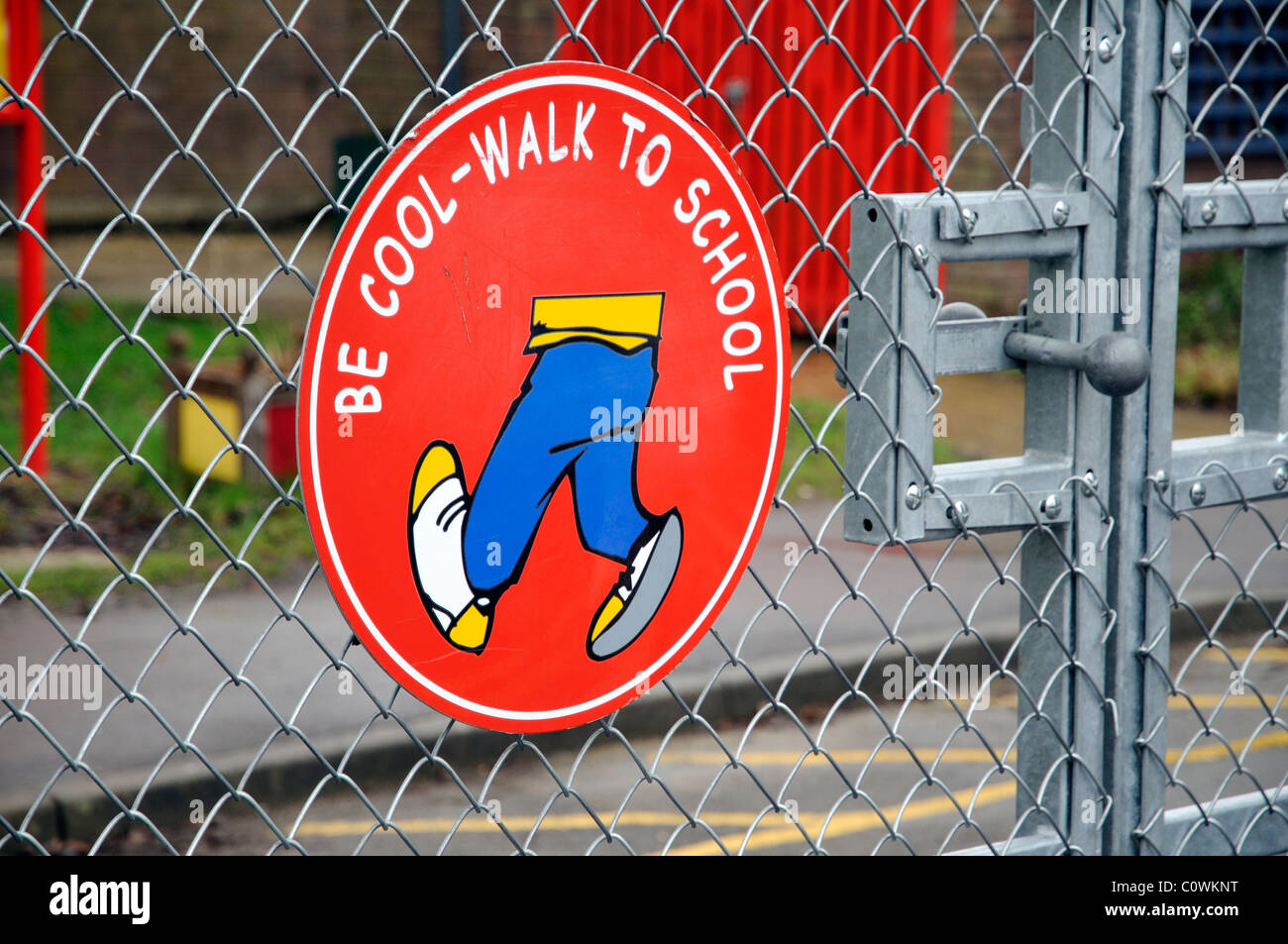 Be Cool Walk to School sign on a school gate England UK Stock Photo