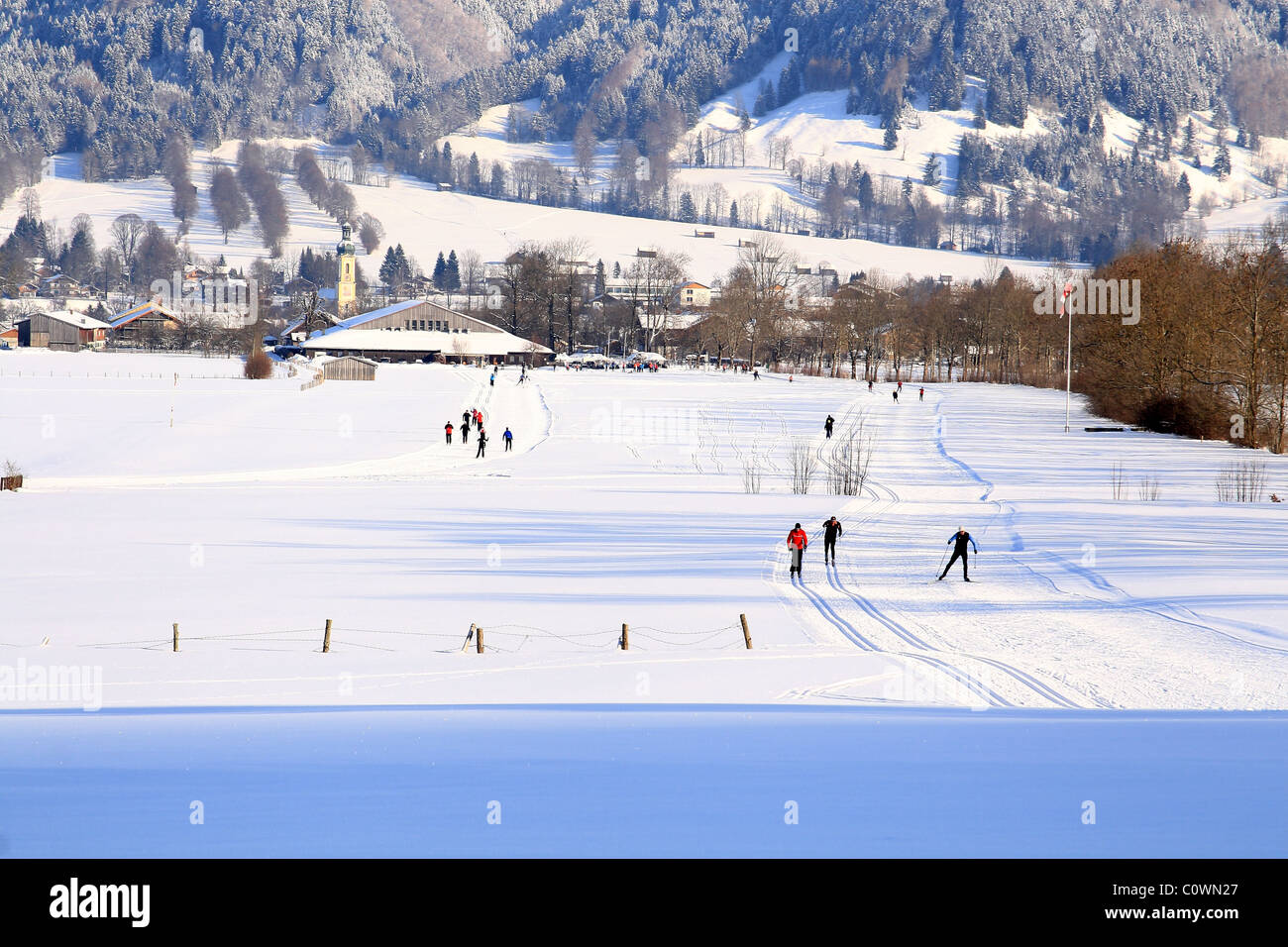 Skiers on trail. Cross country ski area in Lenggries. Upper Bavaria. Germany. Stock Photo