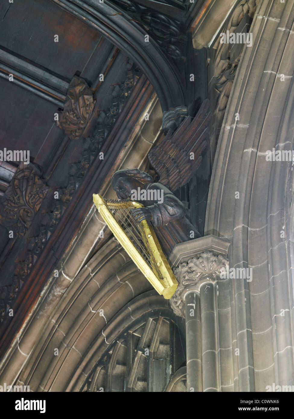 Manchester Cathedral angel with harp Stock Photo