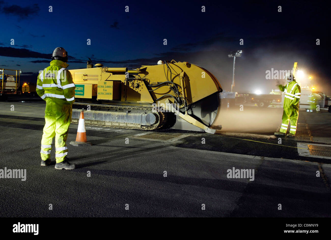 road worker at nigh resurfacing road Stock Photo