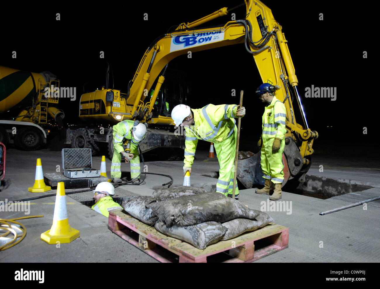 road worker at nigh resurfacing road Stock Photo