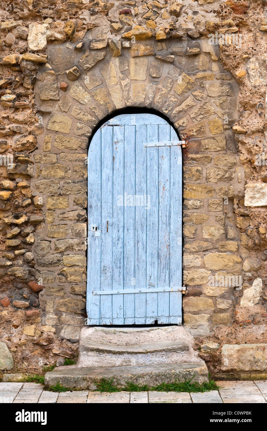 Old Oak door and arched stone doorway - sud-Touraine, France. Stock Photo