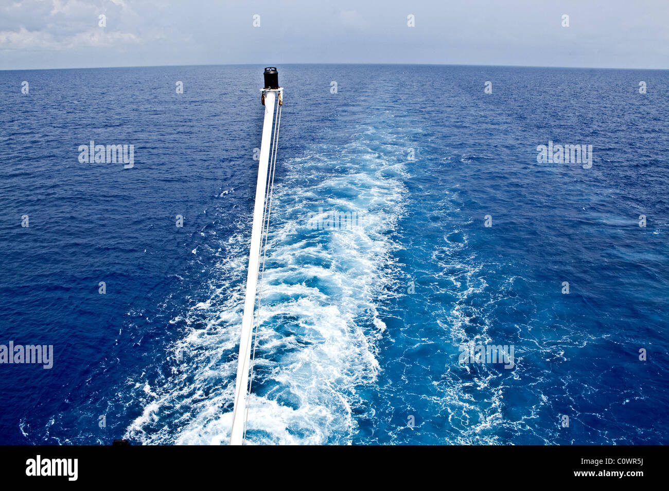 Wake behind a cruise ship on a calm ocean Stock Photo