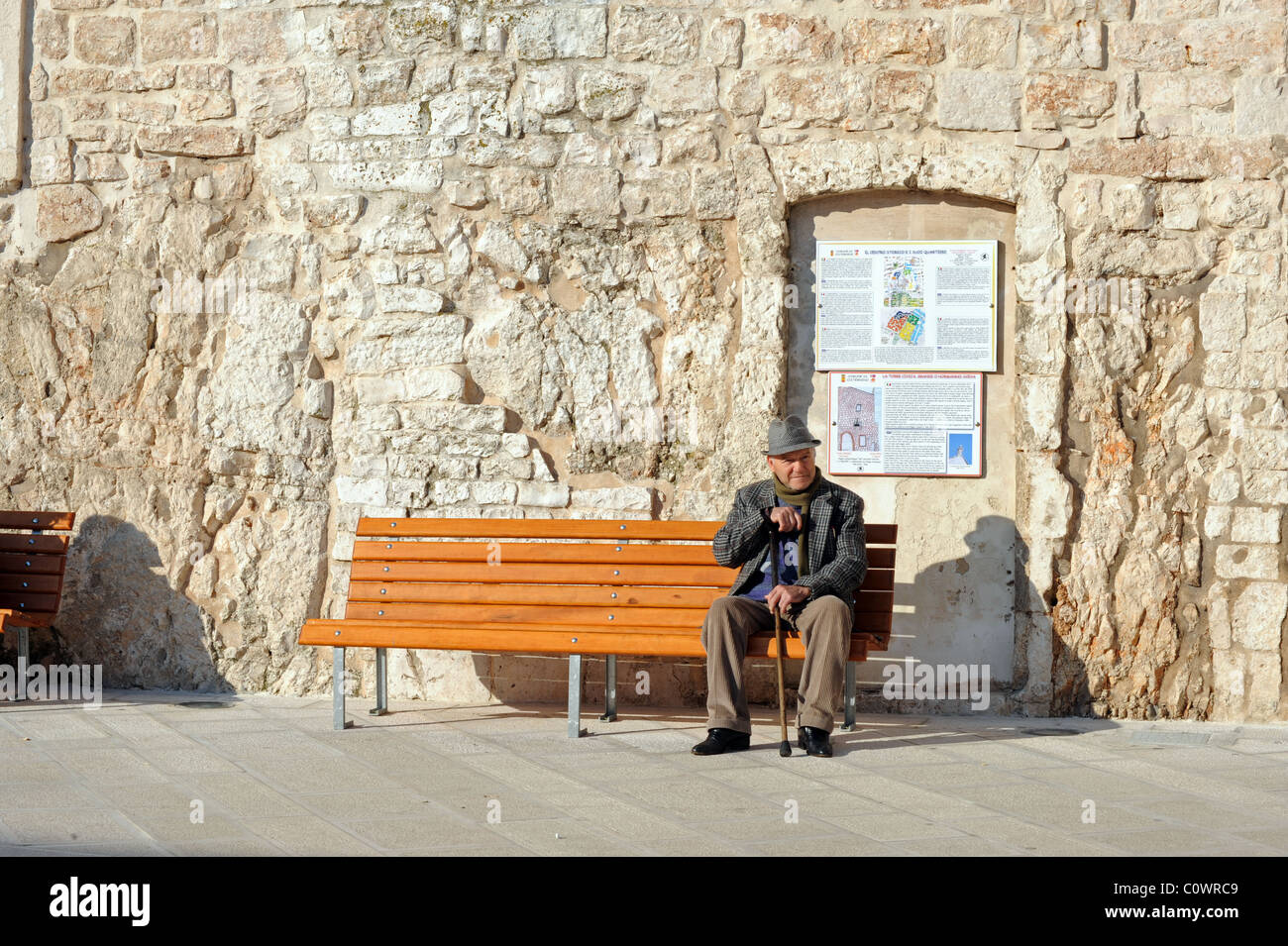 Old man sitting on stone hi-res stock photography and images - Alamy
