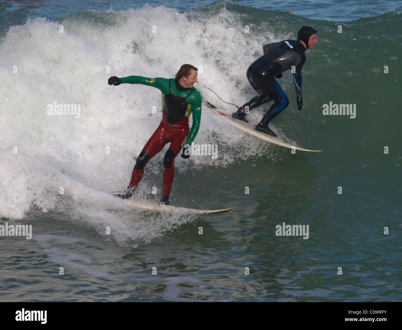 Two surfers, Newquay, Cornwall, UK Stock Photo