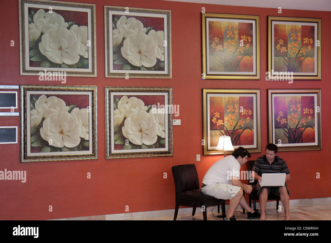 Orlando Florida,International Drive,Radisson Hotel Orlando,lobby,adult adults man men male,laptop computer,wireless Internet access signal,visitors tr Stock Photo