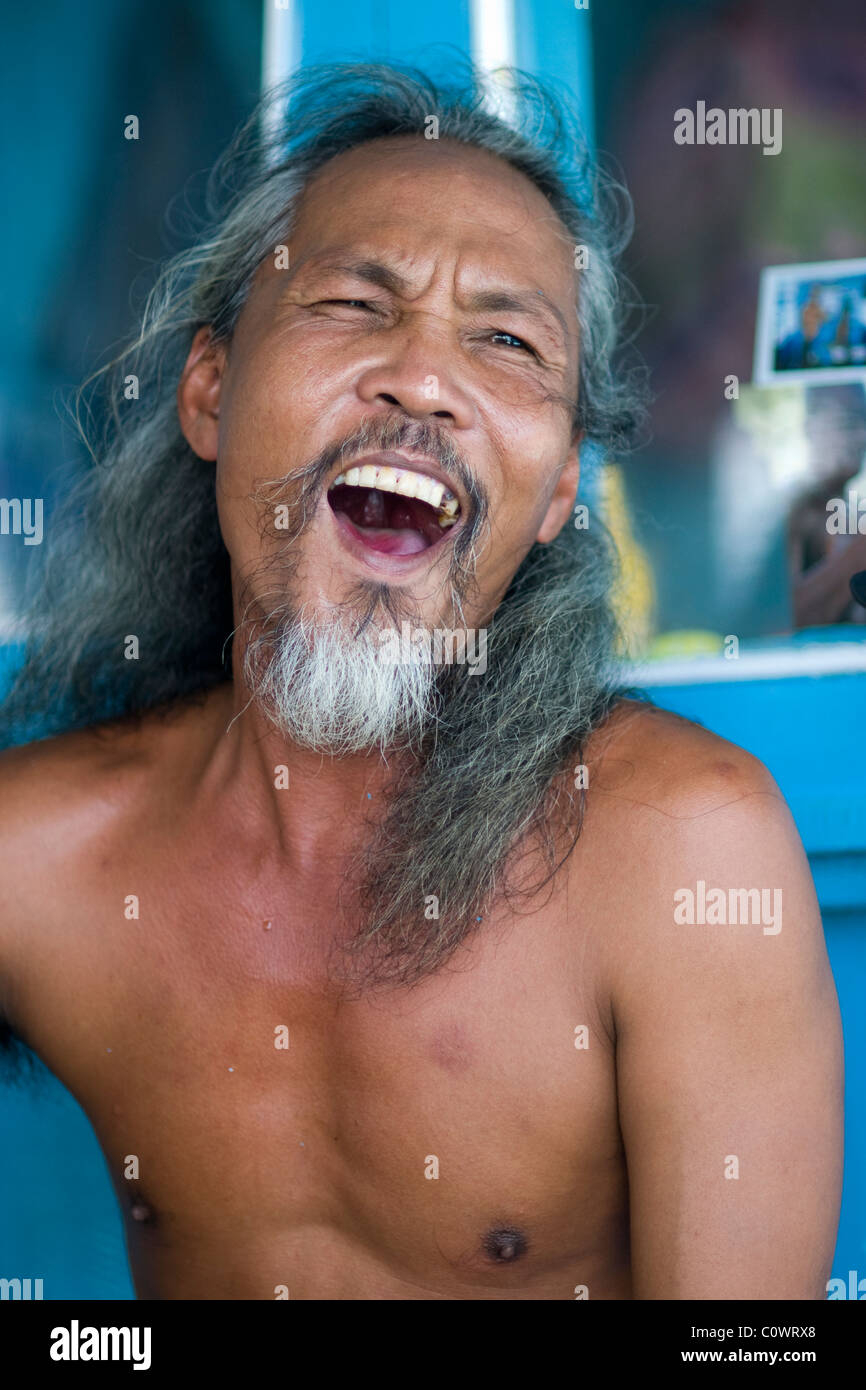 Portrait of a Vietnamese man singing on a boat during a day trip to Nha ...