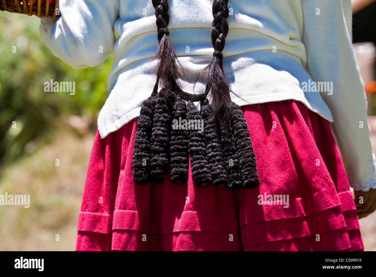 Hair decoration on Bolivian Lady on Sun Island, Lake Titicaca, Bolivia, South America. Stock Photo