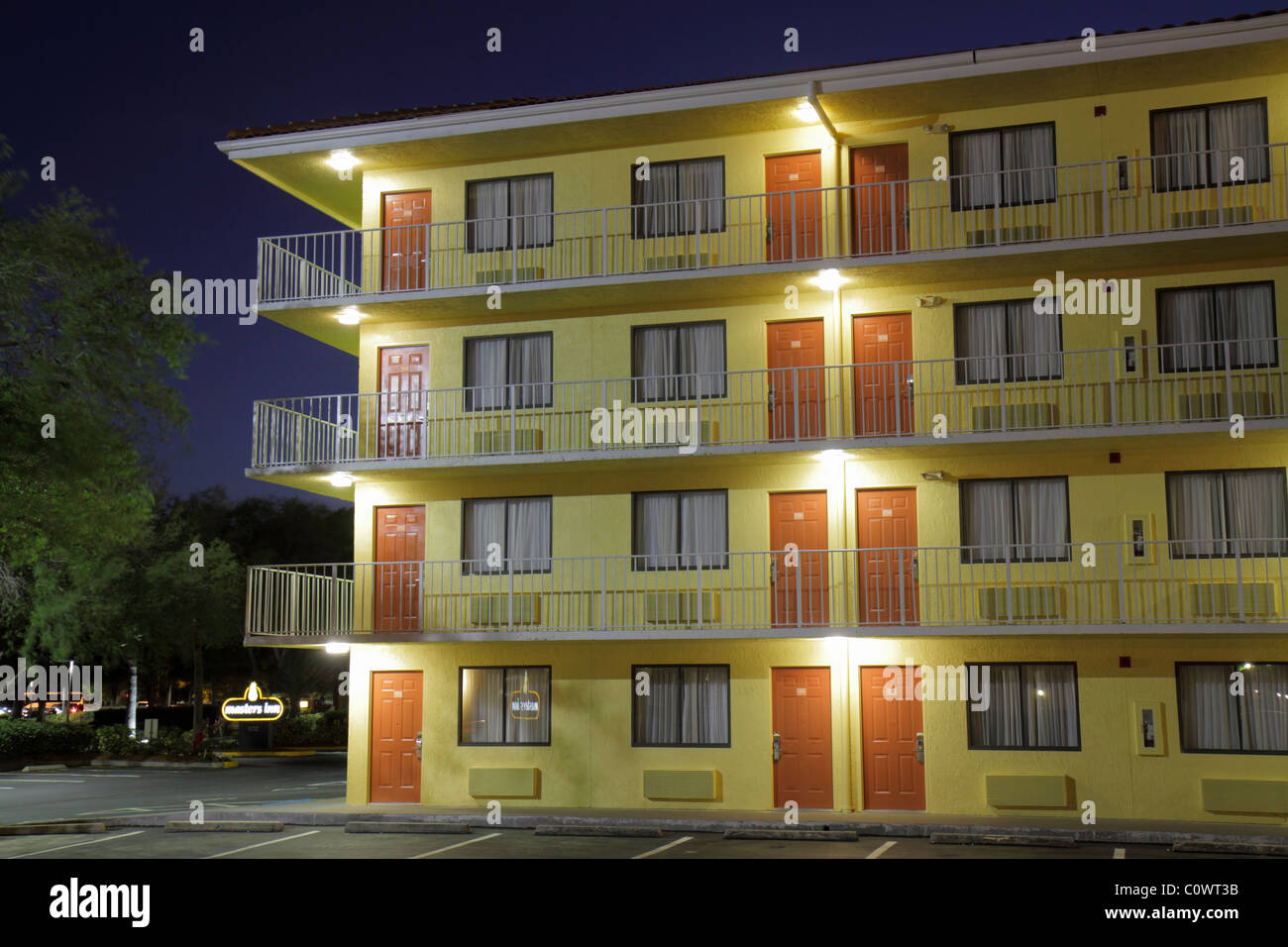 Orlando Florida,International Drive,dusk,evening,night,hotel hotels lodging inn motel motels,building,balconies,doors,windows,well lit,visitors travel Stock Photo