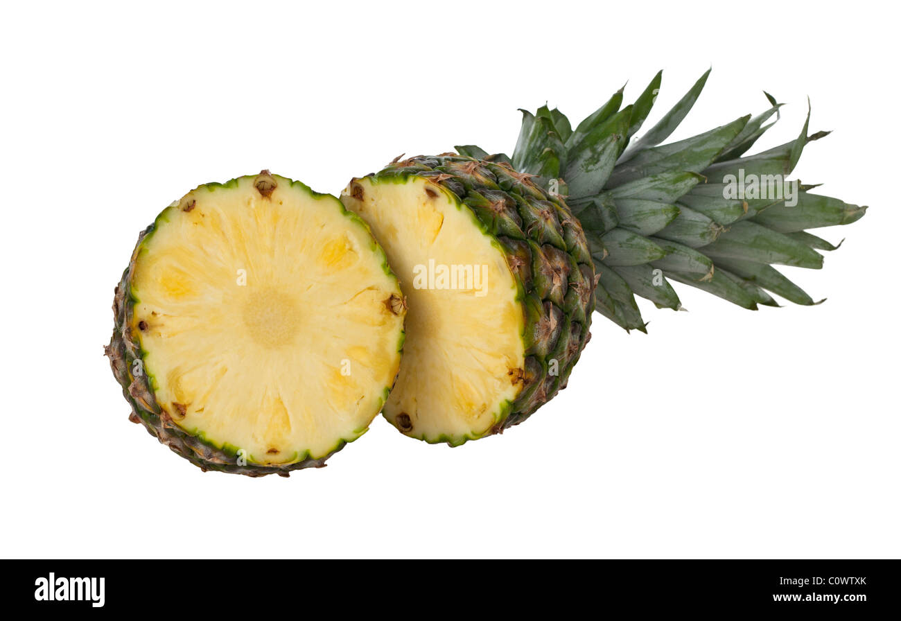 fresh pineapple sliced in half isolated against a white background Stock Photo