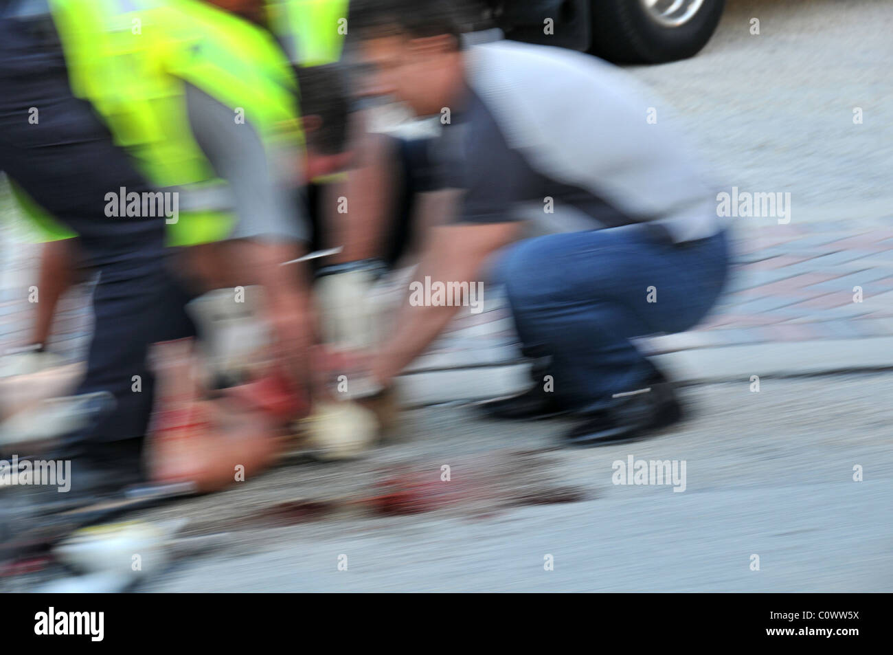 Ambulance personnel caring for accident victim. Stock Photo