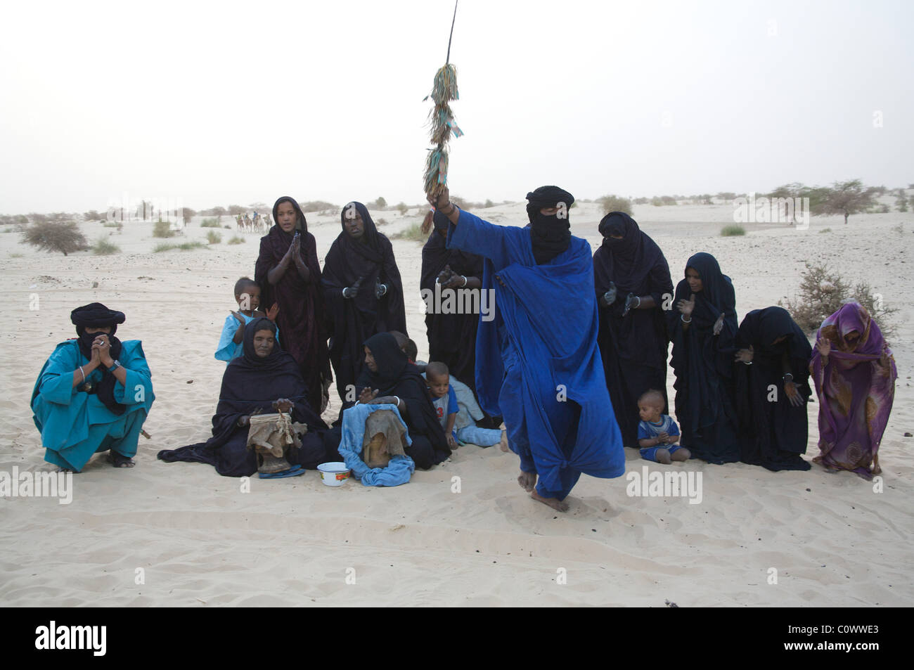 Tuareg nomads doing a traditional dance in their desert camp near Timbuktu, Mali, West Africa Stock Photo