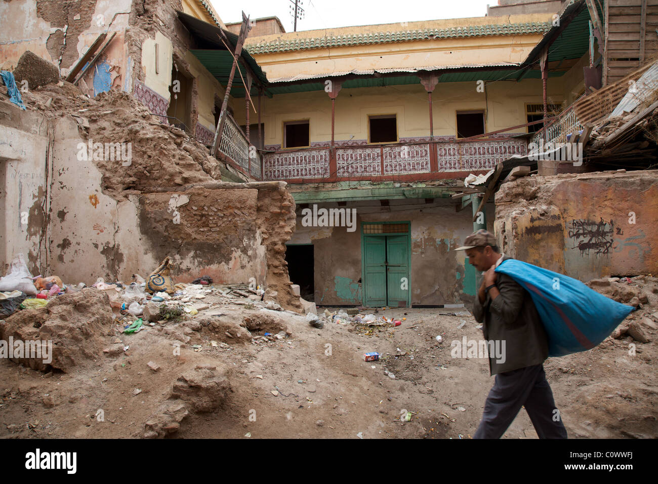 A man walks past a collapsed riad, Marrakech medina, Morocco, North Africa Stock Photo