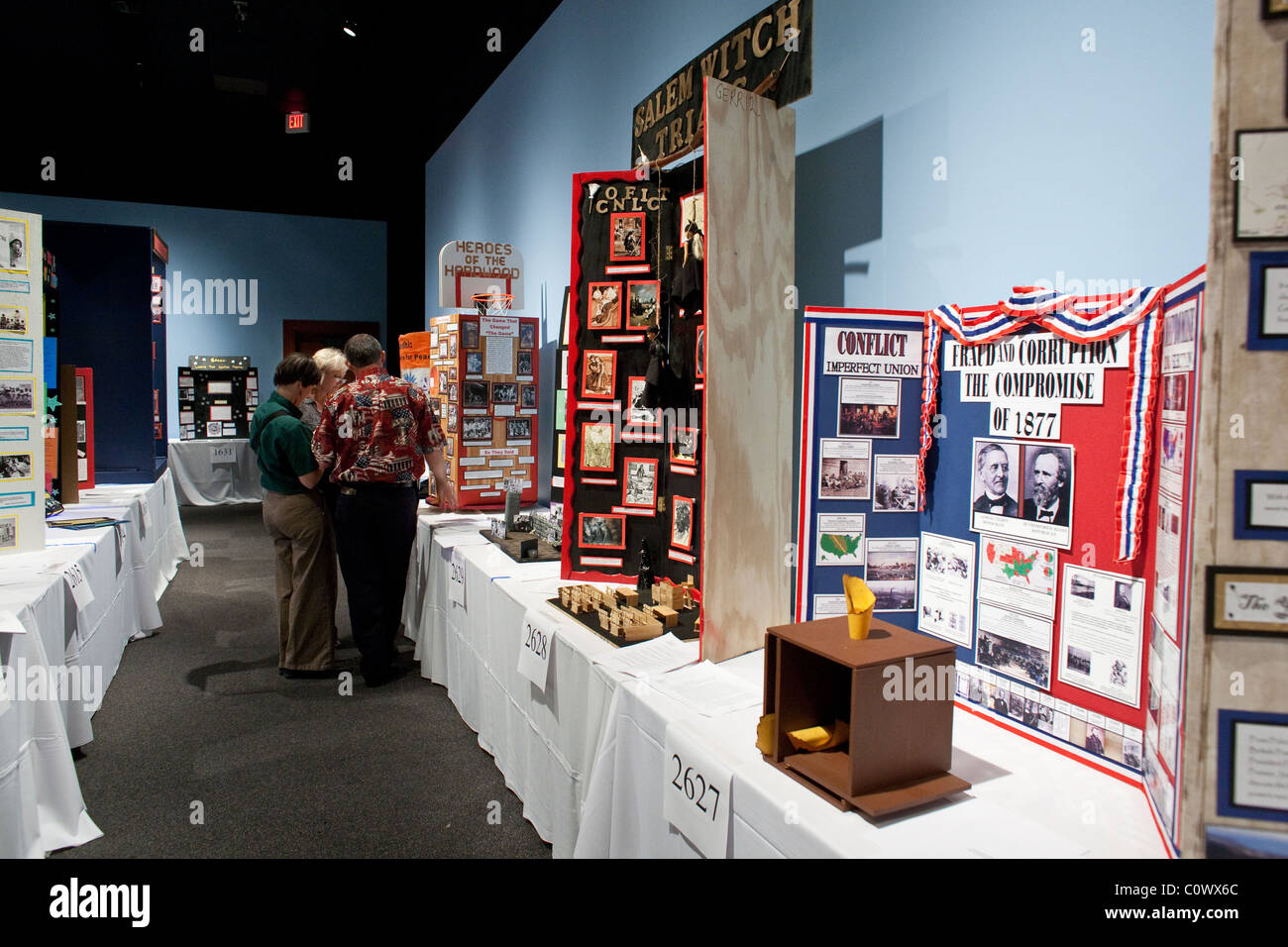 Male and female judges evaluate displays during Texas History Day competition at the Bob Bullock State History Museum in Austin Stock Photo