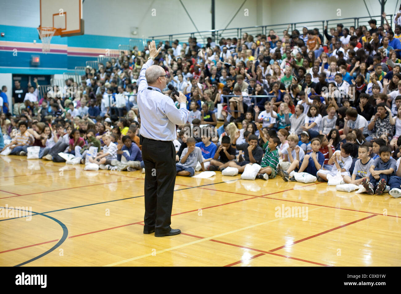 Middle school principal calls for students' attention at beginning of