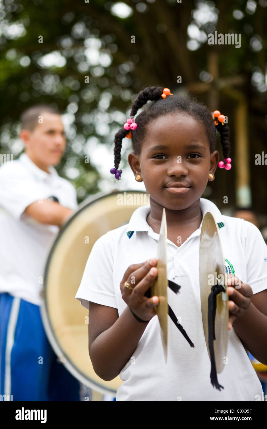 Children from Colombia playing musical instruments. The music project has been funded by Fairtrade banana exports Stock Photo