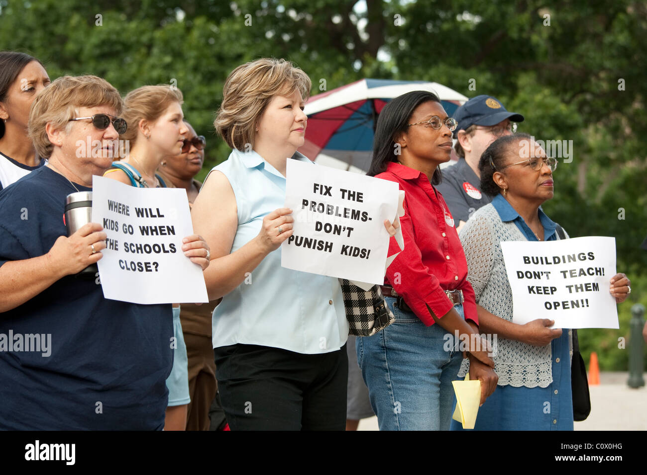 Parents of public school students protest proposed school closures due ...