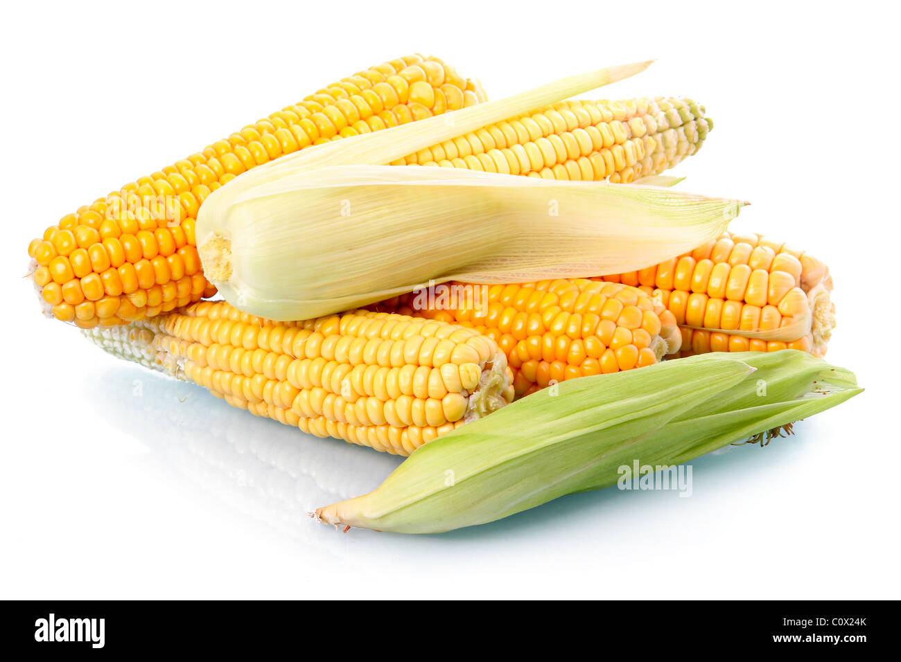 Fresh corn vegetable with green leaves isolated Stock Photo