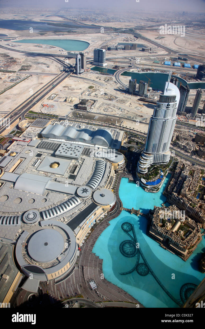 Exterior of Dubai Mall Fashion Avenue with valet parked expensive cars  outside , Downtown Dubai, United Arab Emirates