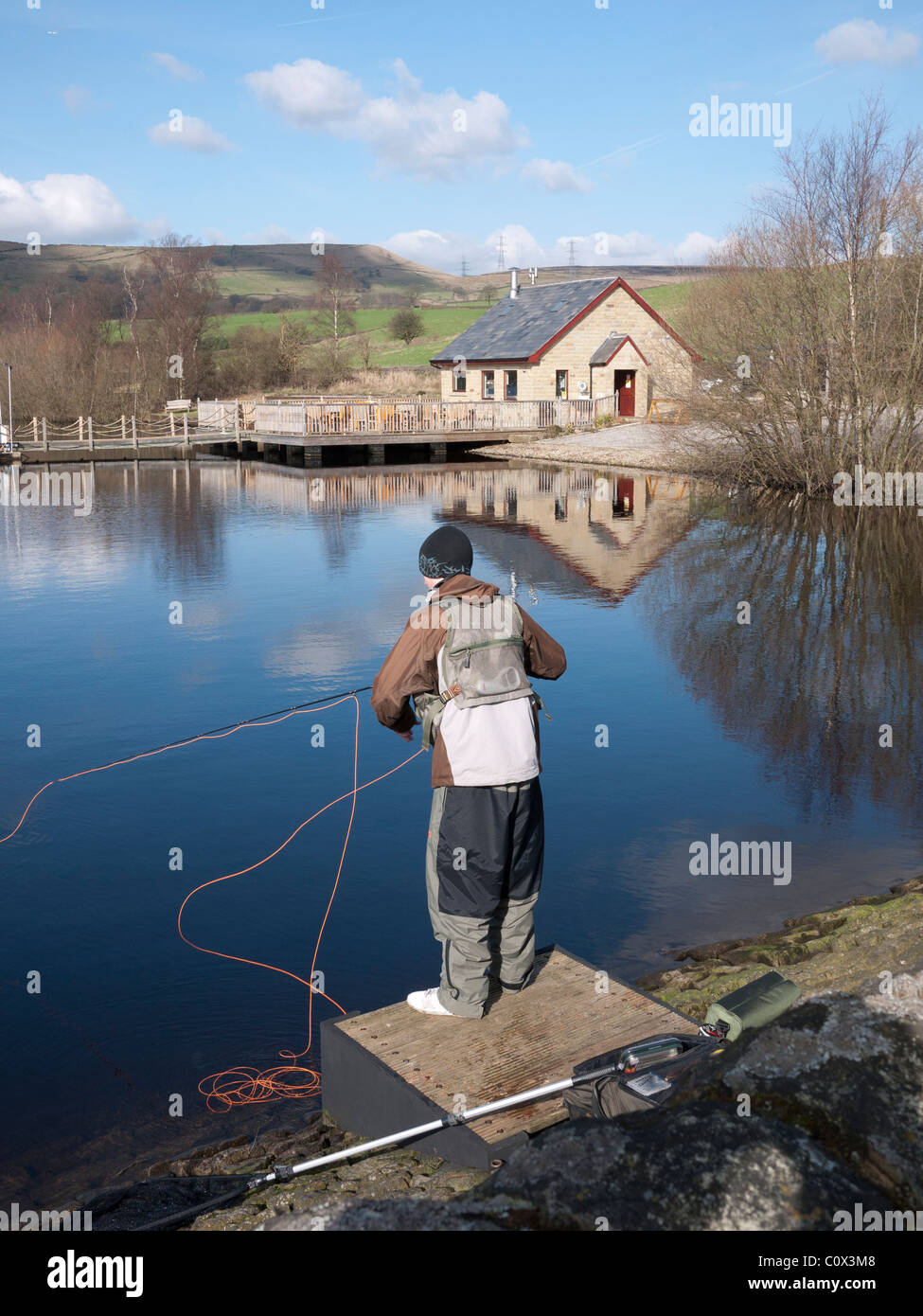 Young angler fly fishing for trout, England, UK. Stock Photo