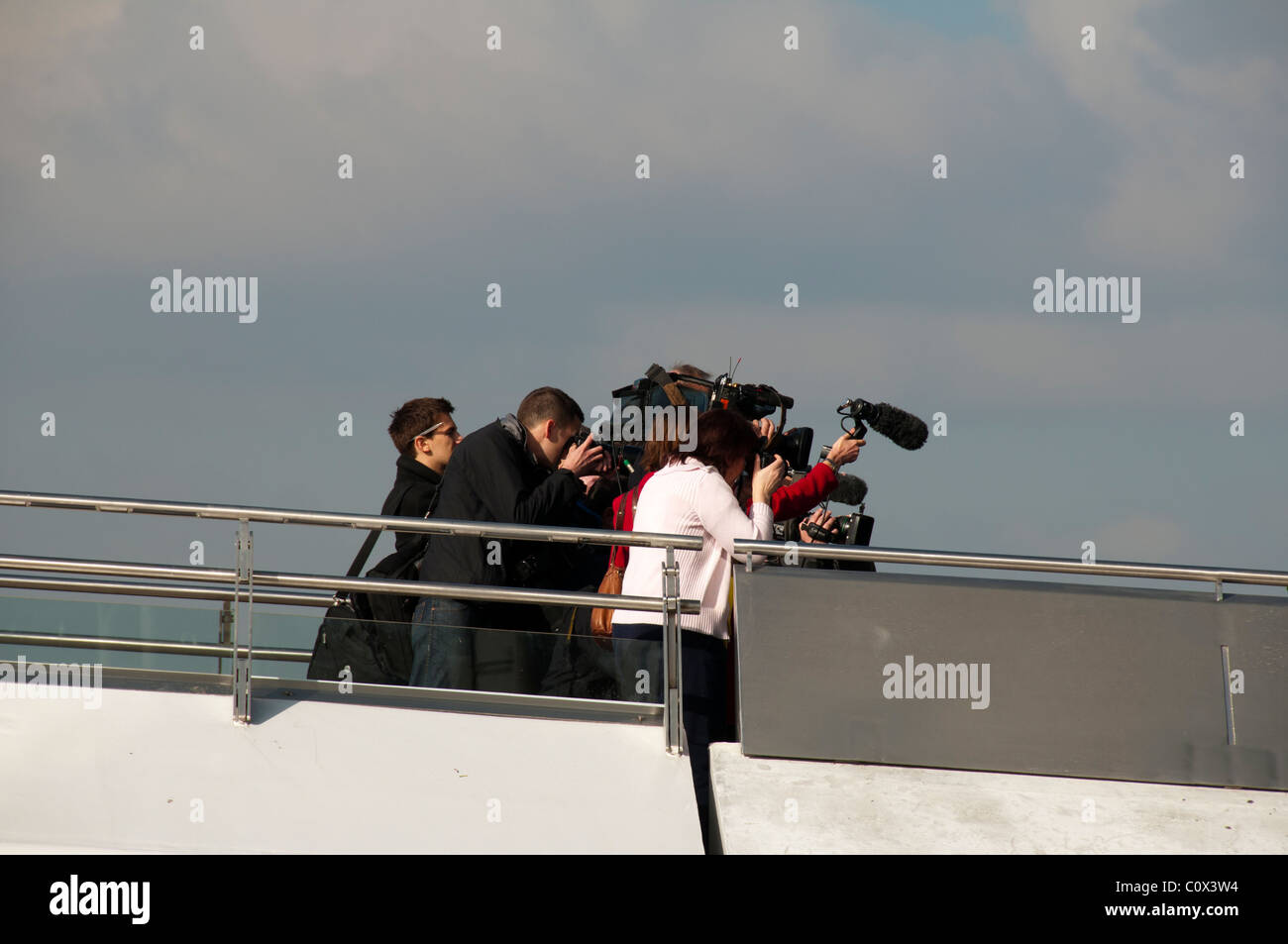 Photographers on the MediaCityUK swing footbridge at the official opening, 1 March 2011.  Salford Quays, Manchester, UK Stock Photo