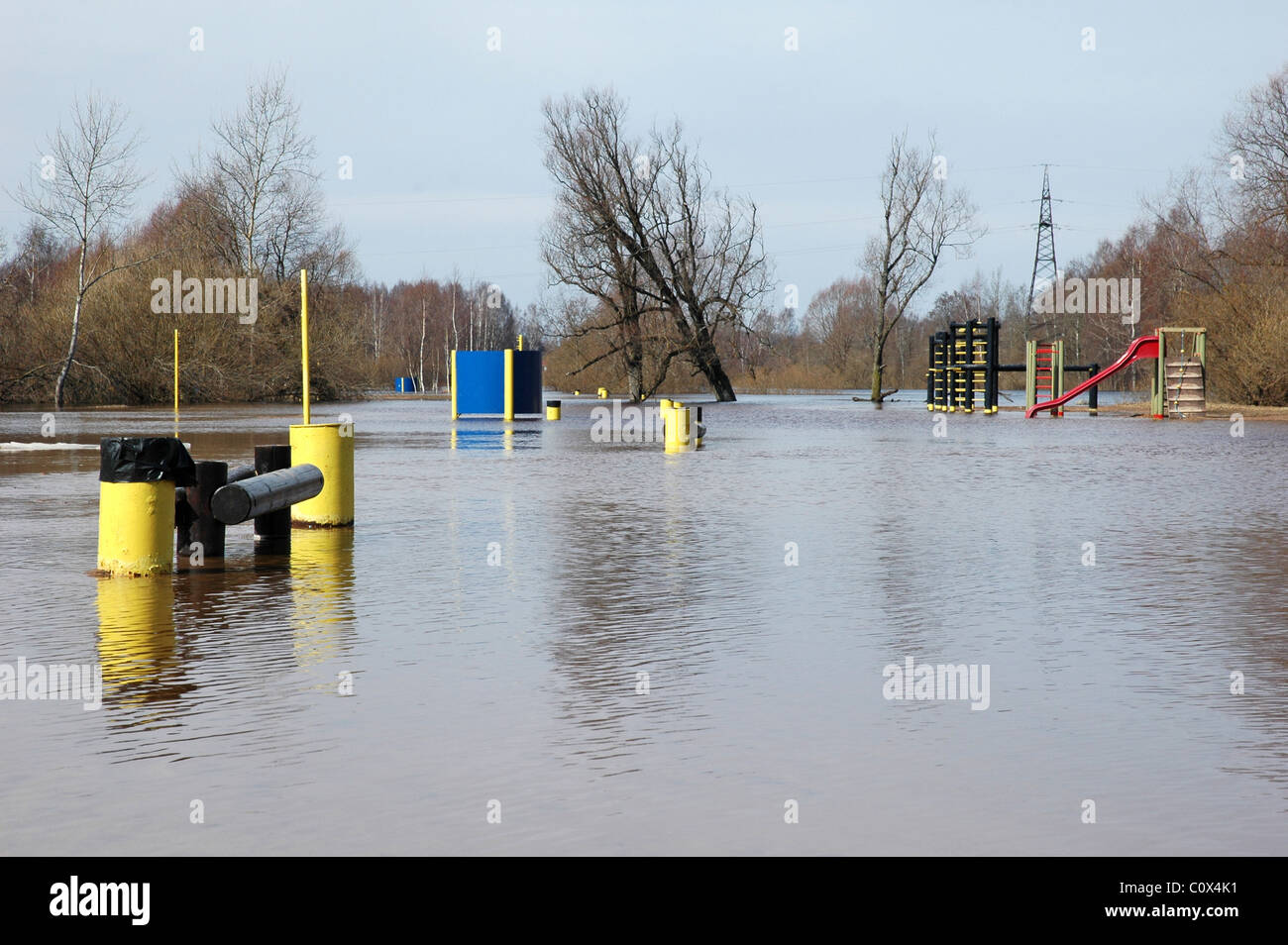 flood surrounds playground at spring Stock Photo
