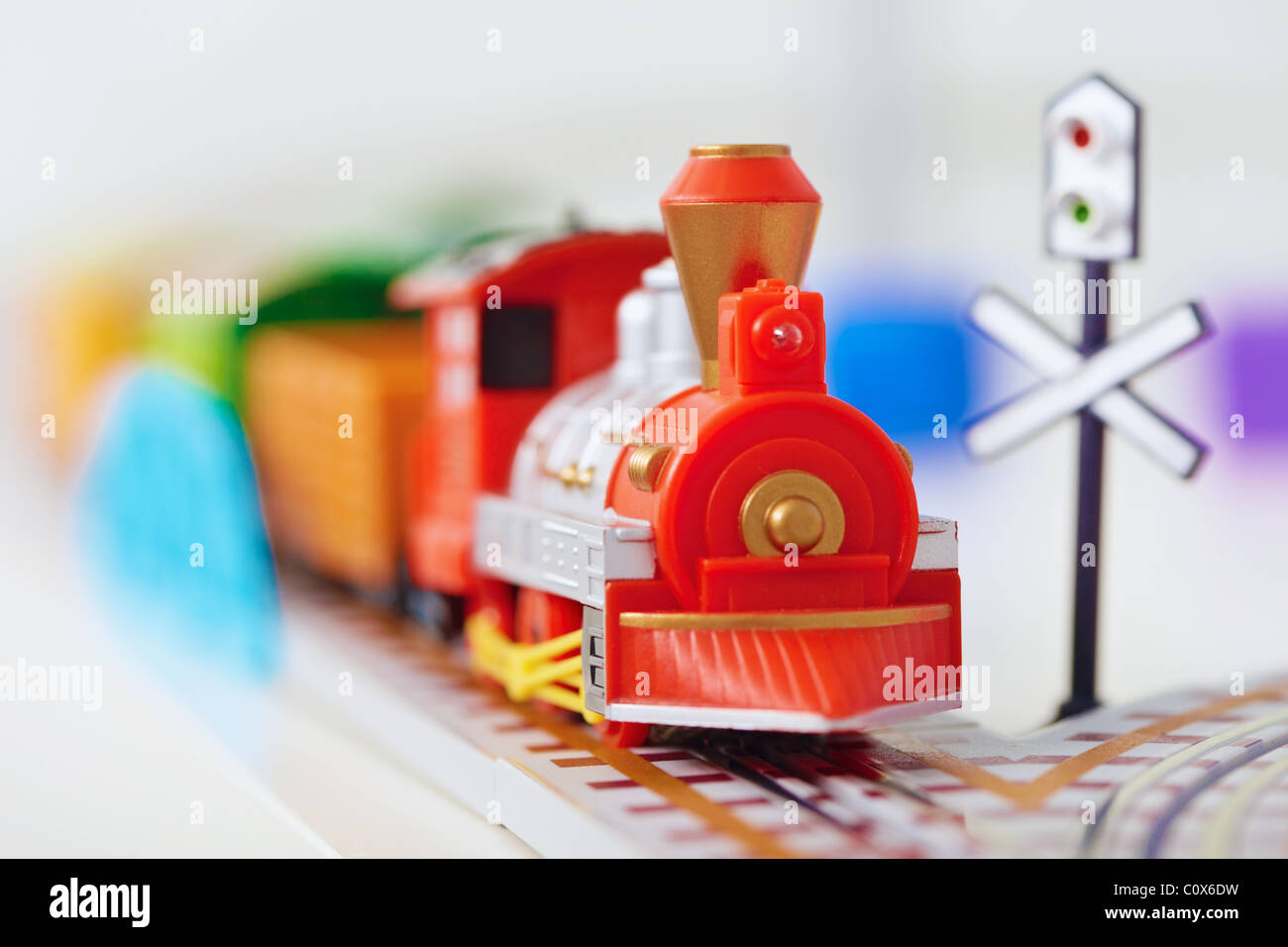 The toy railway - red engine close up Stock Photo