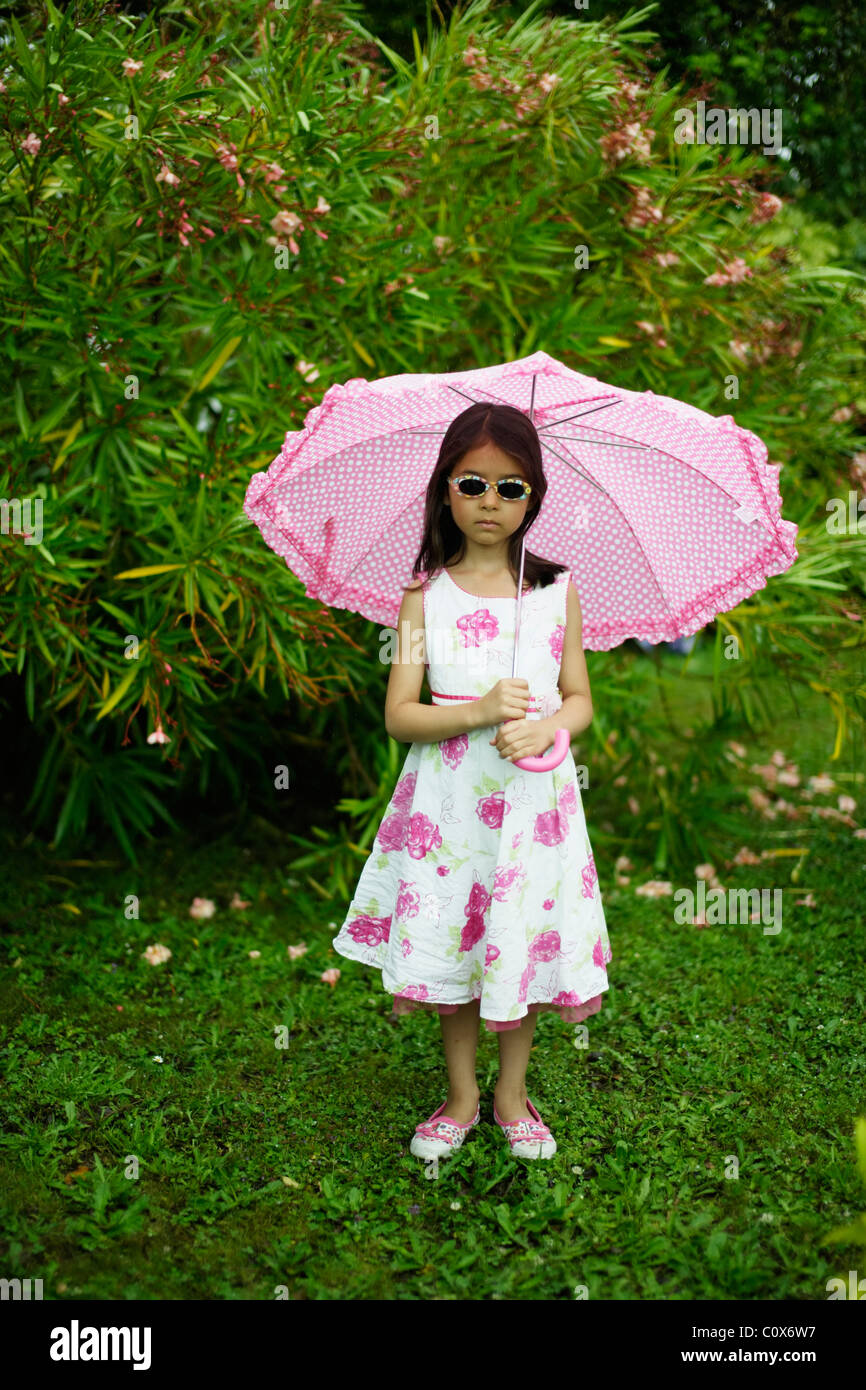 Girl with pink umbrella in summer Stock Photo Alamy