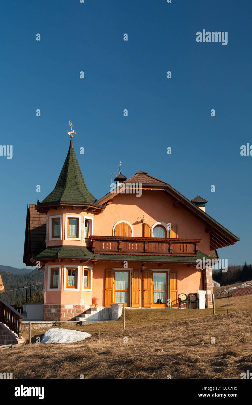 Big house on blue sky background close up Stock Photo - Alamy