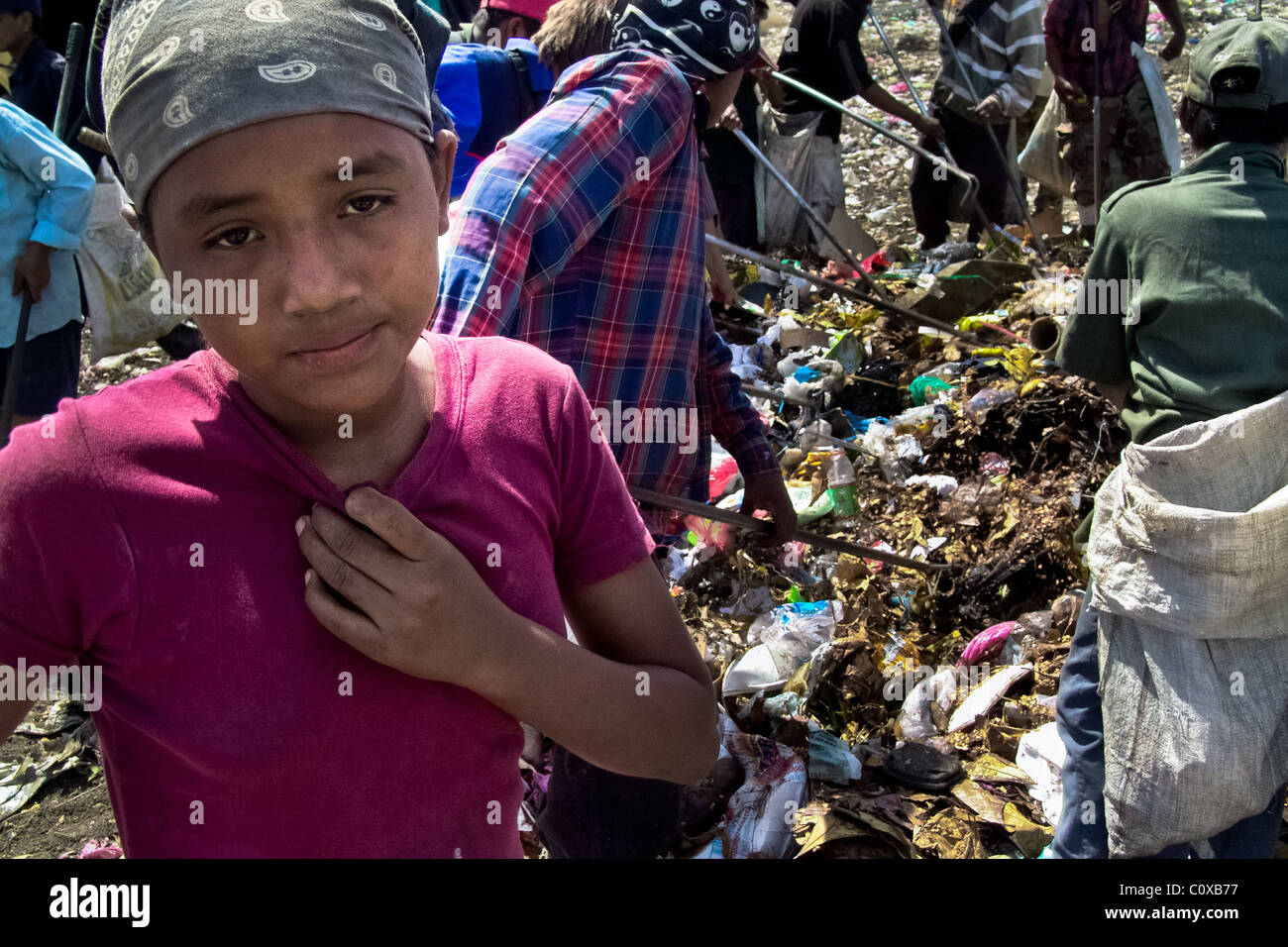 A Nicaraguan girl works in the garbage dump La Chureca, Managua, Nicaragua. Stock Photo