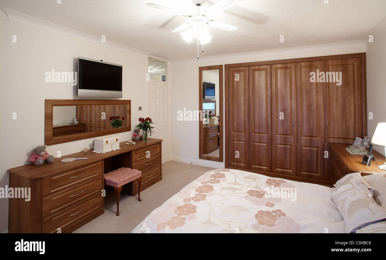 A bedroom with wooden oak furniture. Stock Photo