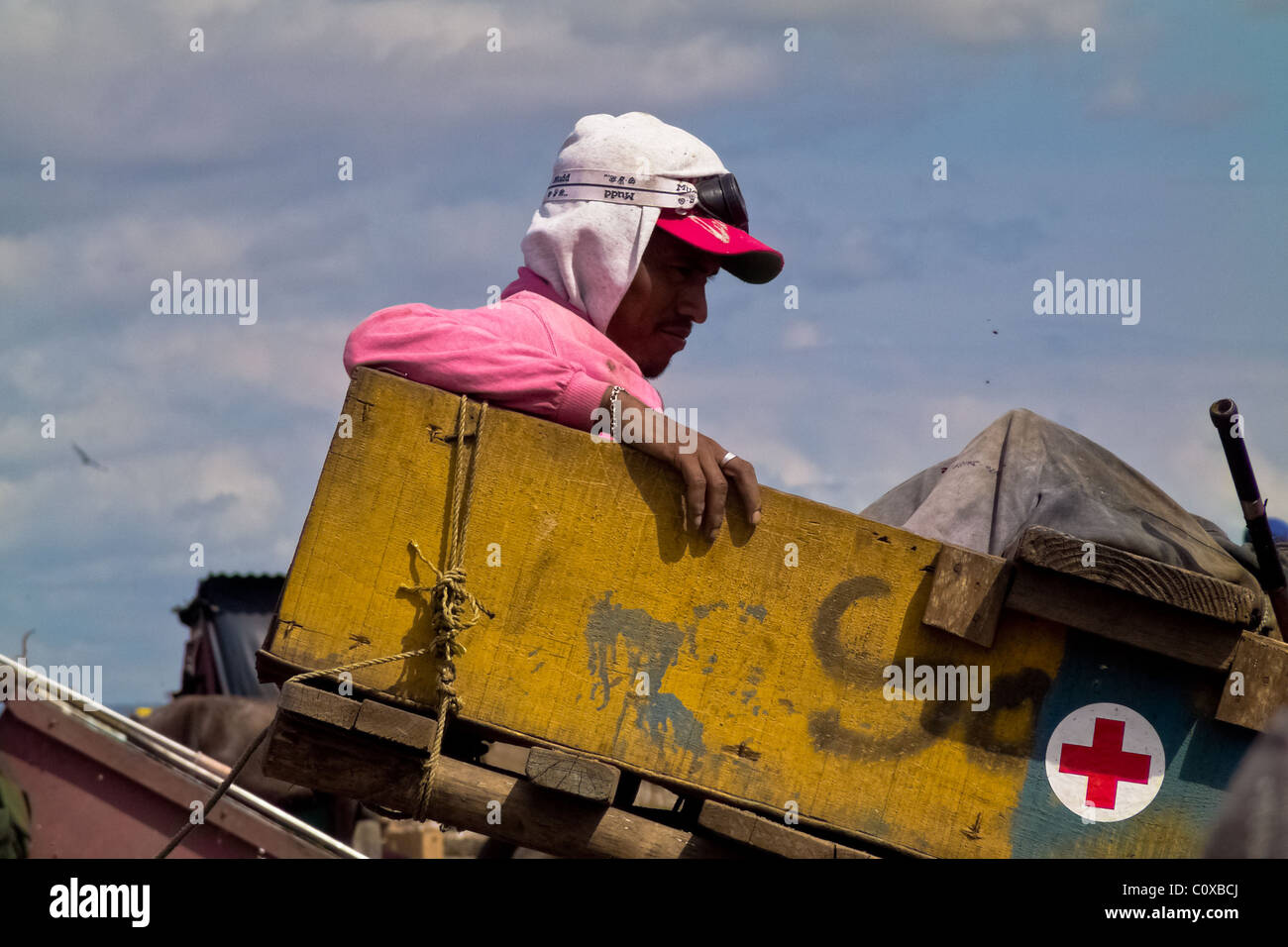 A Nicaraguan garbage recollector rests in the garbage dump La Chureca, Managua, Nicaragua. Stock Photo