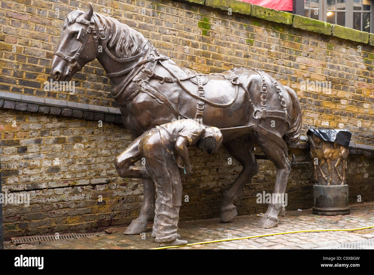 Camden Town or Lock or Horses or Stables Market , London , sculpture or statue of blacksmith or