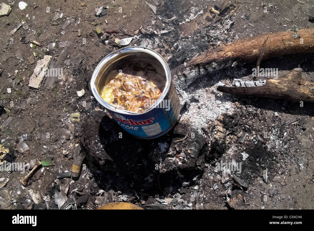 A chicken soup boiled in a can in the garbage dump La Chureca, Managua, Nicaragua. Stock Photo