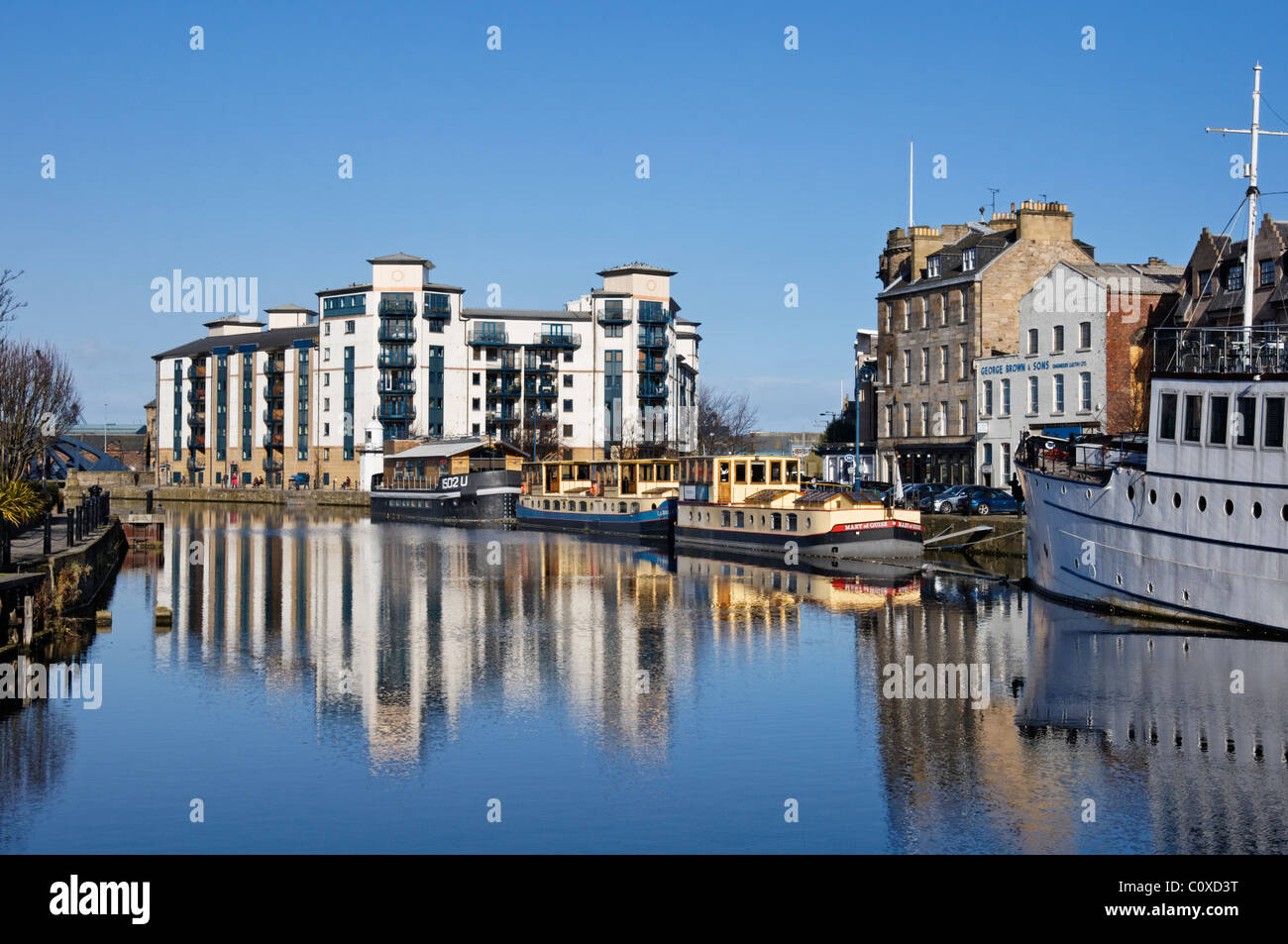 Modern apartment blocks alongside the Water of Leith, Leith, Edinburgh, Scotland, UK Stock Photo