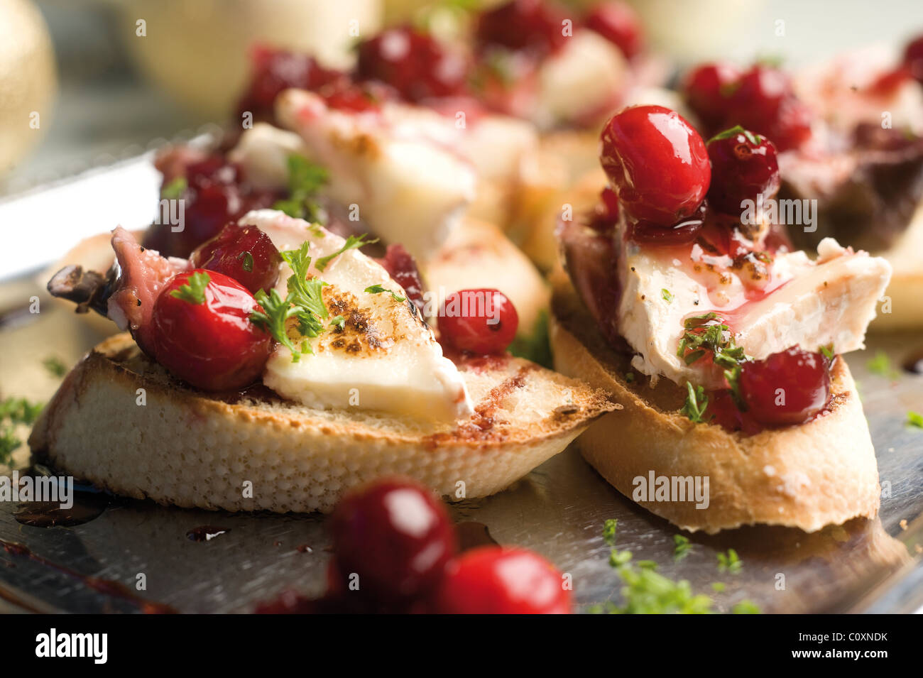 Poached red wine figs with goats cheese, cranberries and balsamic glaze