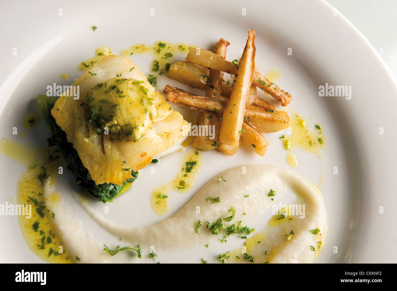 Pan fried cumin cod with jeruselam artichokes, parsnip chips and curry ...