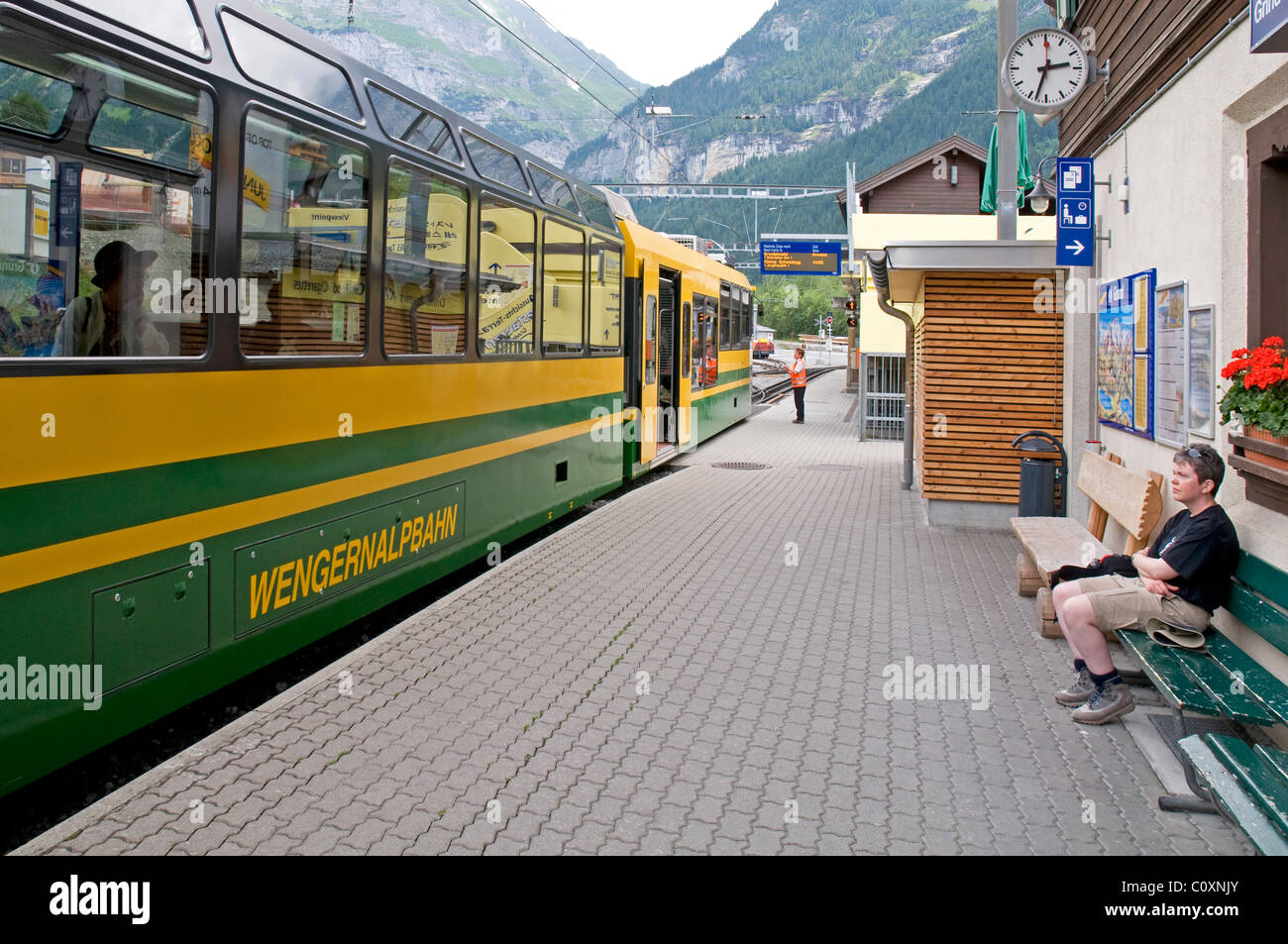 WengernalpbahnTrain at Grund, Switzerland, departing for Kleine Scheidegg Stock Photo