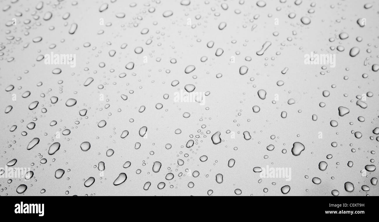 Water drops on grey silver colored metal surface Stock Photo