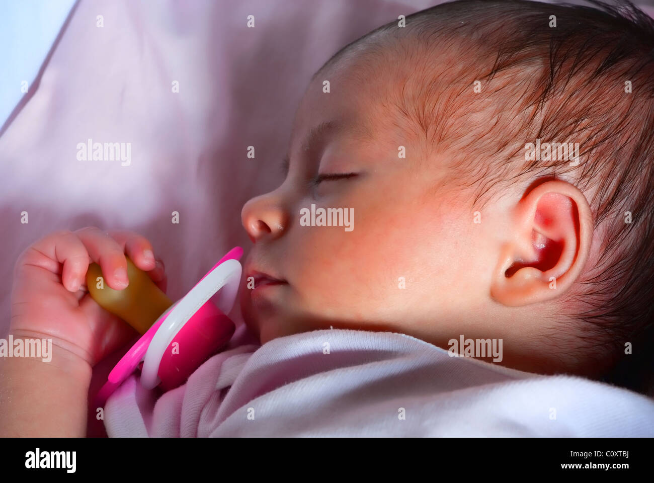 Newborn Baby Girl Sleeping in her Crib Stock Photo Alamy